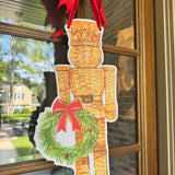 Wicker Nicholas Nutcracker Door Hanger